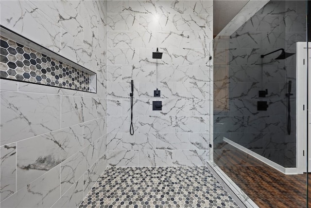 bathroom featuring tiled shower