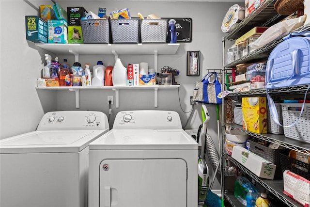 washroom with washing machine and clothes dryer