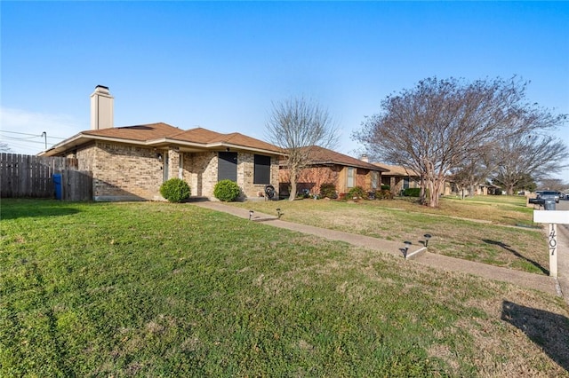 ranch-style house with a front lawn