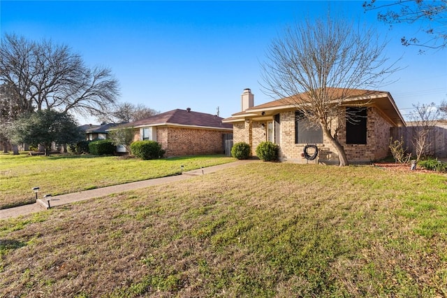 ranch-style house with a front lawn