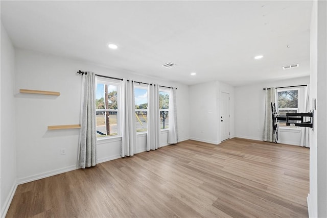 unfurnished living room featuring light wood-type flooring