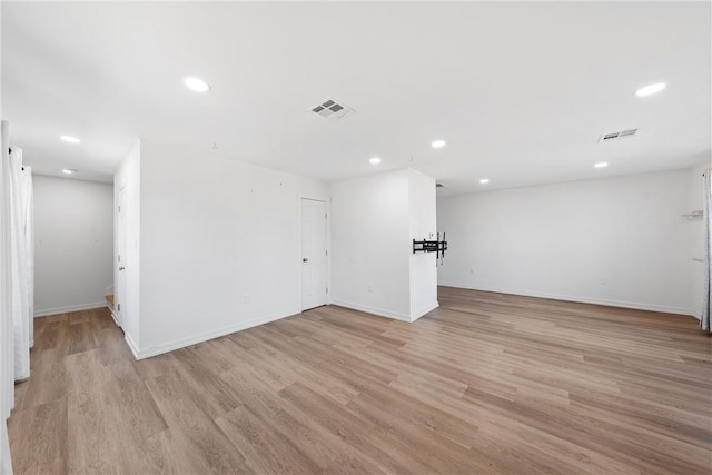 spare room with light hardwood / wood-style flooring