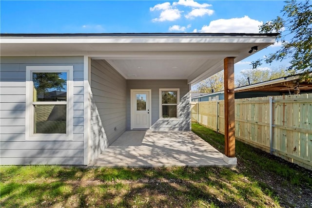 entrance to property with a patio area