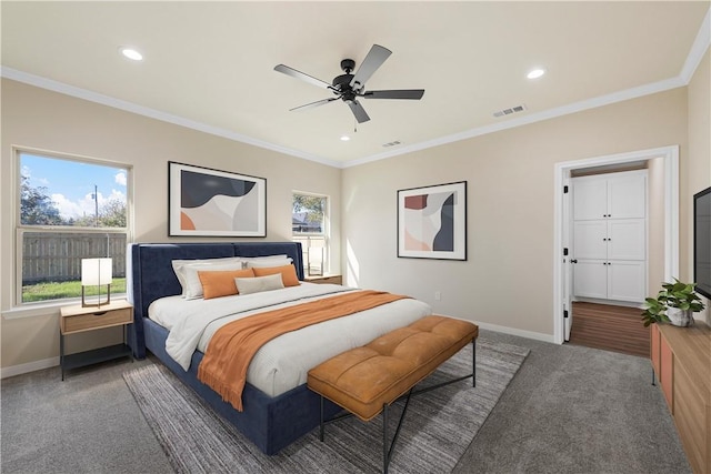 carpeted bedroom featuring ceiling fan and crown molding