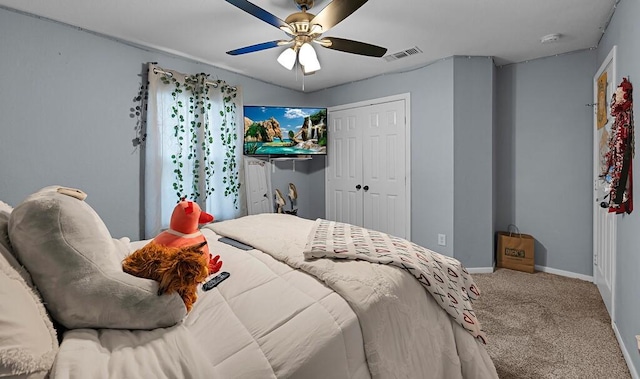 bedroom featuring a closet, ceiling fan, and carpet flooring