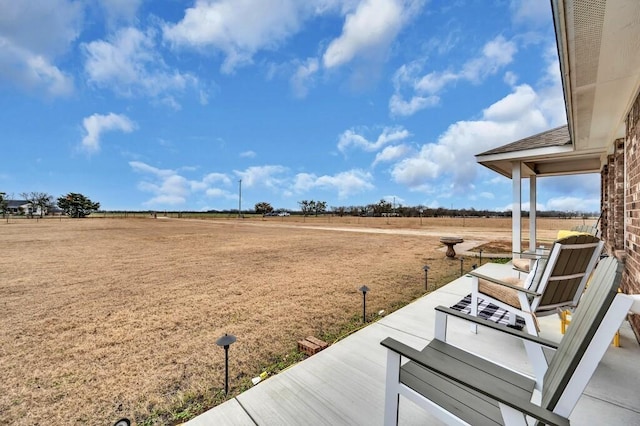 view of yard with a rural view