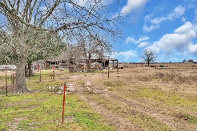 view of yard featuring an outbuilding and a rural view