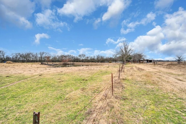 view of yard with a rural view