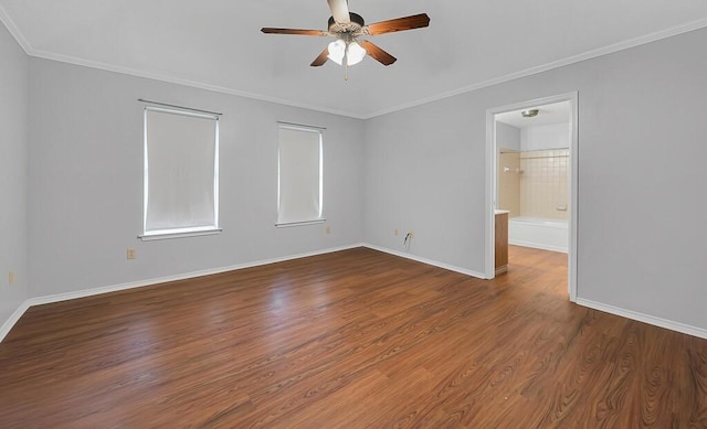 spare room featuring hardwood / wood-style flooring, crown molding, and ceiling fan