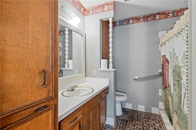 bathroom featuring vanity, tile patterned floors, toilet, a textured ceiling, and curtained shower