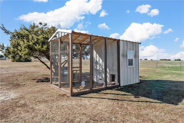 view of outdoor structure with a rural view