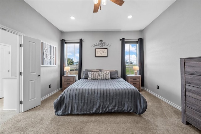 carpeted bedroom featuring ceiling fan