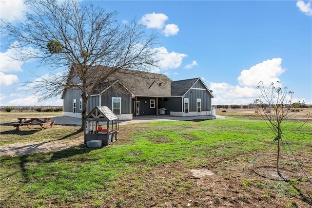 back of house with a yard