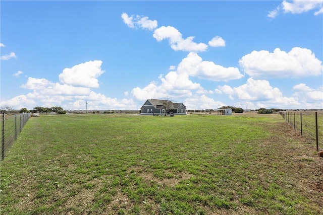 view of yard with a rural view