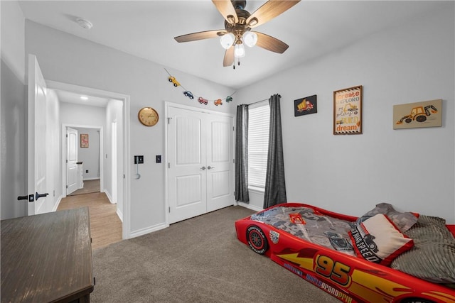 bedroom with carpet flooring, ceiling fan, and a closet