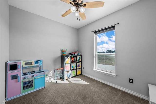 recreation room featuring carpet and ceiling fan