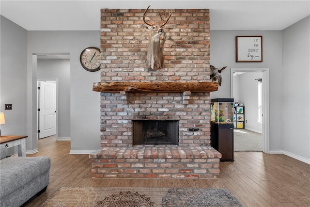 living room featuring hardwood / wood-style floors and a fireplace