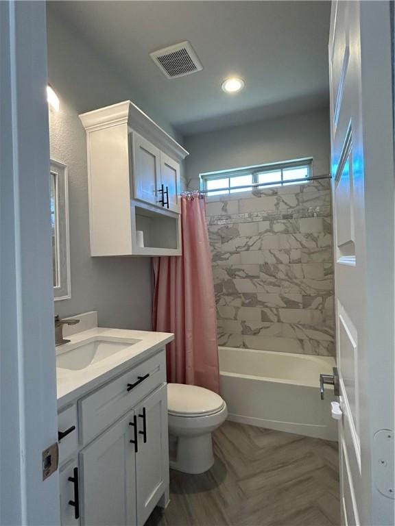 full bathroom with vanity, shower / bath combination with curtain, and toilet