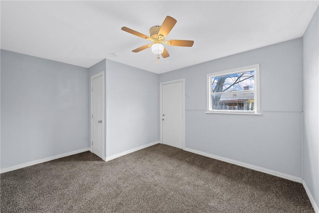 spare room with carpet and ceiling fan