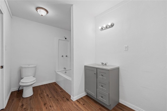 full bathroom with shower / bath combination, vanity, hardwood / wood-style flooring, and toilet