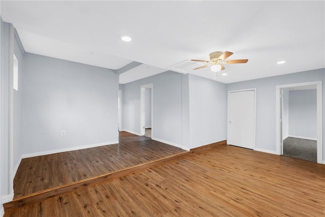 unfurnished living room with hardwood / wood-style floors and ceiling fan