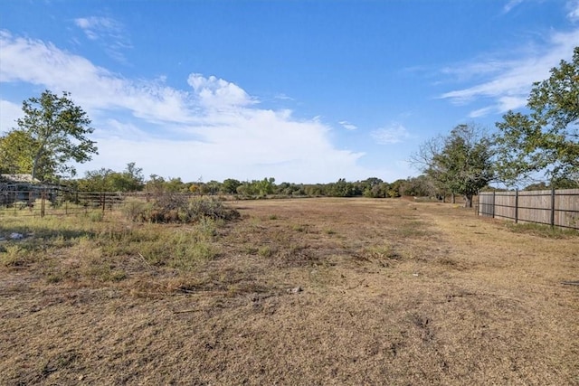 view of yard with a rural view