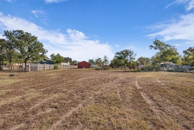 view of yard with a rural view