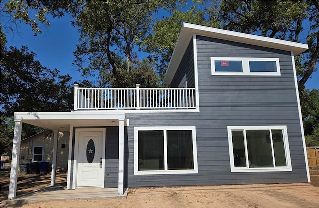 view of front of house with a balcony