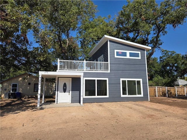 view of front of home with a balcony