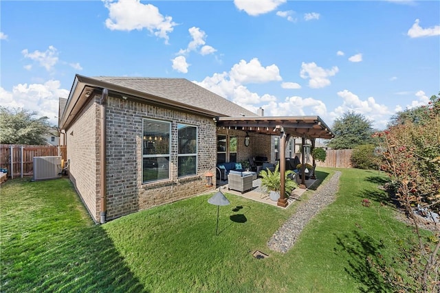 rear view of property with a lawn, an outdoor living space, a patio, and central AC