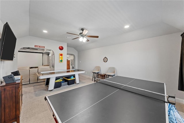 recreation room featuring light carpet, ceiling fan, and vaulted ceiling