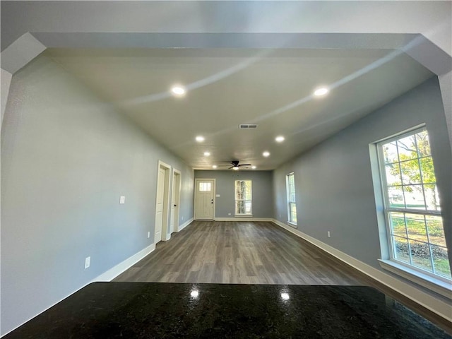 unfurnished living room with ceiling fan and wood-type flooring