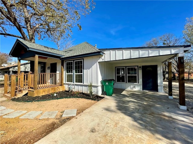 view of front of house featuring a carport and covered porch