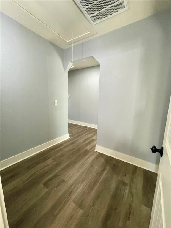 empty room with dark wood-type flooring