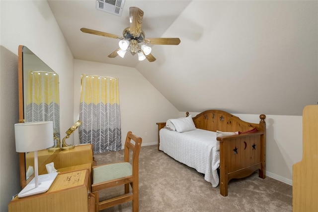 carpeted bedroom with vaulted ceiling and ceiling fan