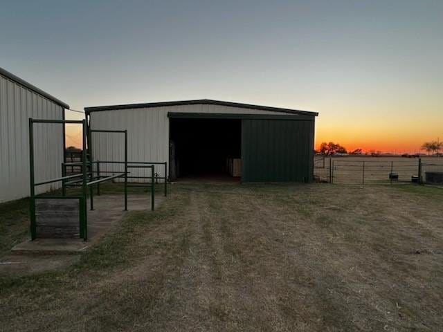 view of outdoor structure at dusk