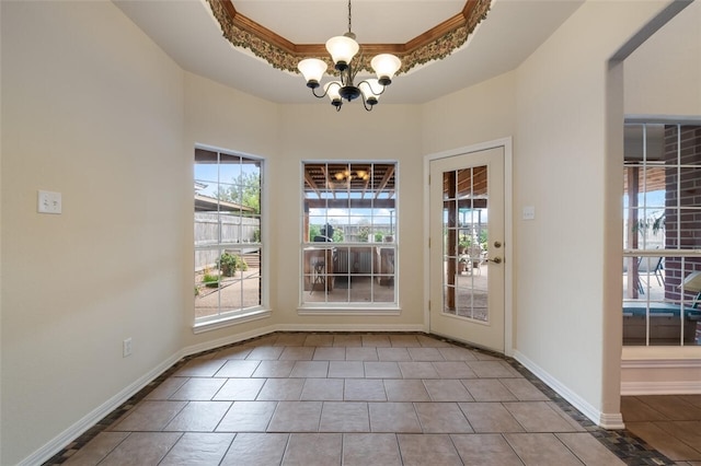 unfurnished dining area featuring a raised ceiling, ornamental molding, light tile patterned floors, and an inviting chandelier