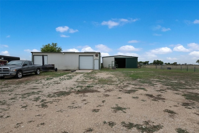 exterior space with an outdoor structure and a garage