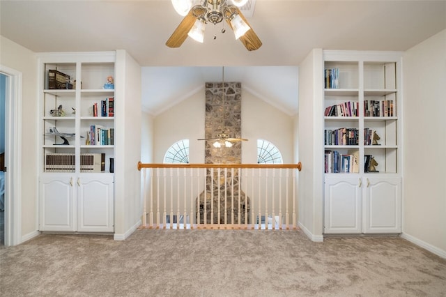 interior space with ceiling fan and lofted ceiling