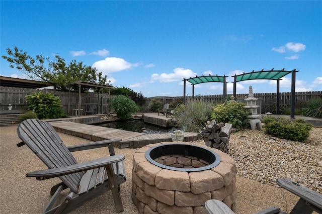 view of patio with an outdoor fire pit