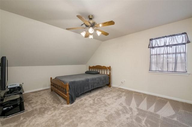 carpeted bedroom featuring ceiling fan and lofted ceiling