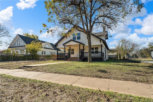 view of front of home featuring a front lawn and a porch