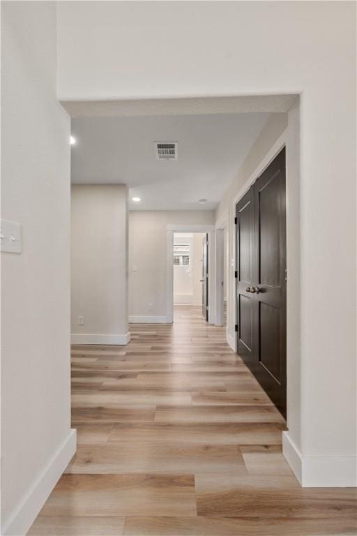 hallway featuring light hardwood / wood-style floors