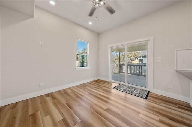 empty room with light wood-type flooring and ceiling fan