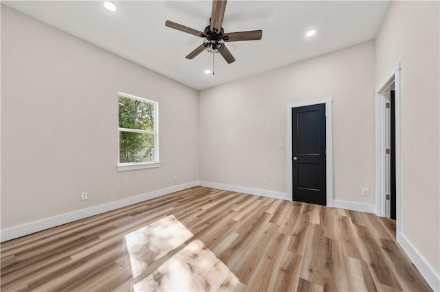 spare room with ceiling fan and light hardwood / wood-style flooring