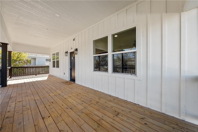 wooden terrace with a porch