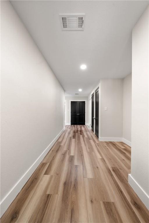 hallway featuring light wood-type flooring