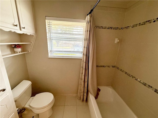 bathroom with toilet, tile patterned flooring, and shower / tub combo