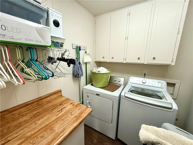 washroom featuring cabinets and separate washer and dryer