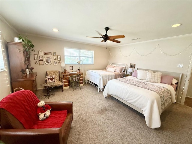 bedroom featuring ceiling fan, ornamental molding, and carpet flooring